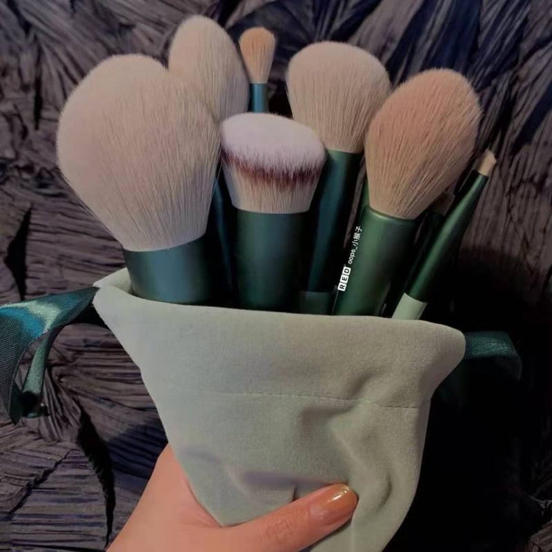 a person holding a bag of makeup brushes